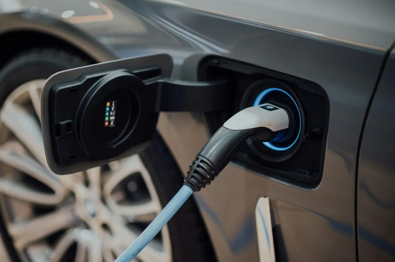 Electric vehicle plugged into a charger