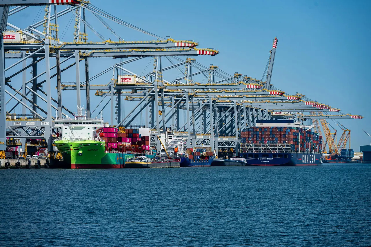Port cranes loading a ship